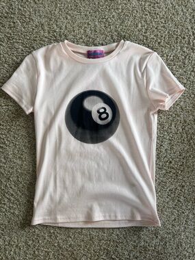 Edikted Light Pink Short Sleeve Tee with Black 8-Ball Graphic
